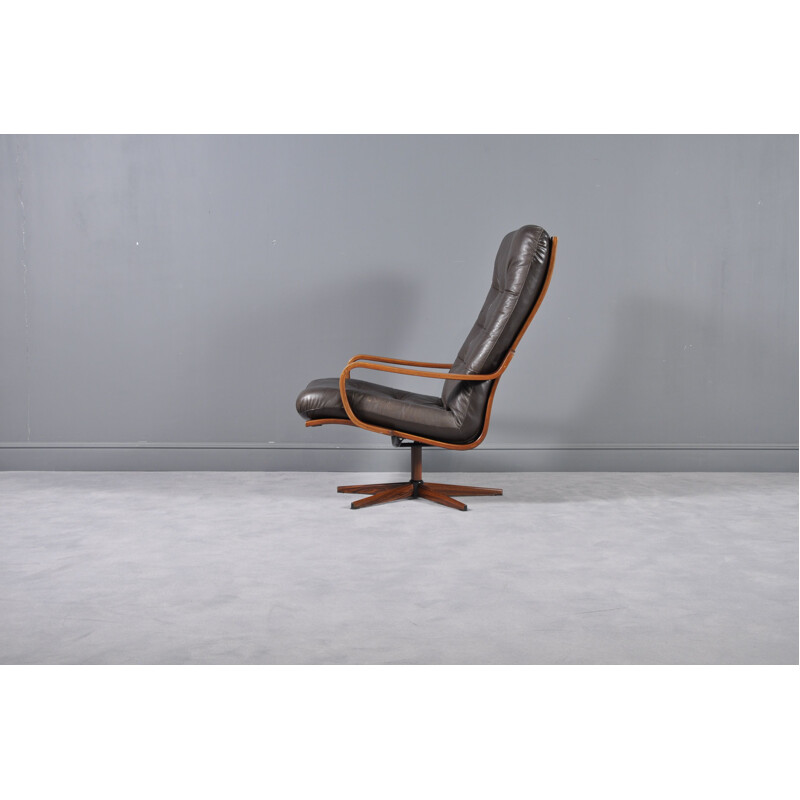 Vintage Swedish leather swivel armchair