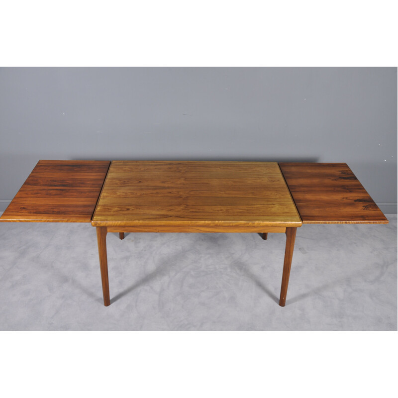 Extendable table in rosewood by Henning Kjærnulf