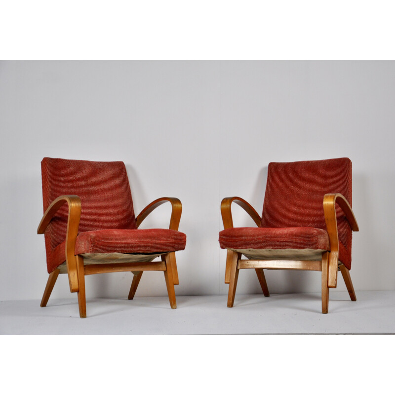Paire de fauteuils rouges en bois