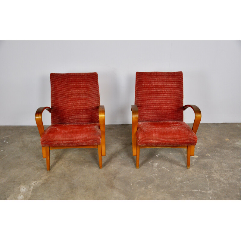 Pair of red wooden armchairs