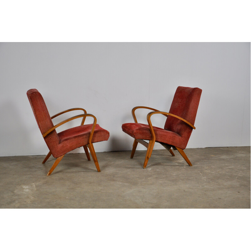 Paire de fauteuils rouges en bois