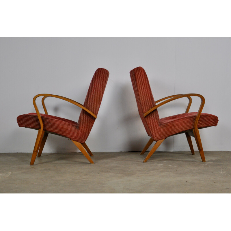 Pair of red wooden armchairs