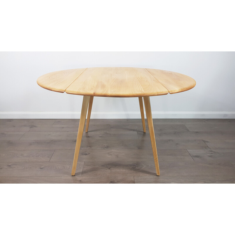 Vintage dining table in elm, Drop Leaf, Round by Lucian Ercolani for Ercol, 1960s.