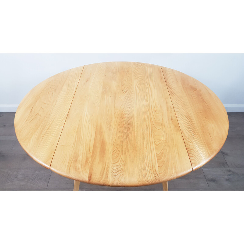 Vintage dining table in elm, Drop Leaf, Round by Lucian Ercolani for Ercol, 1960s.