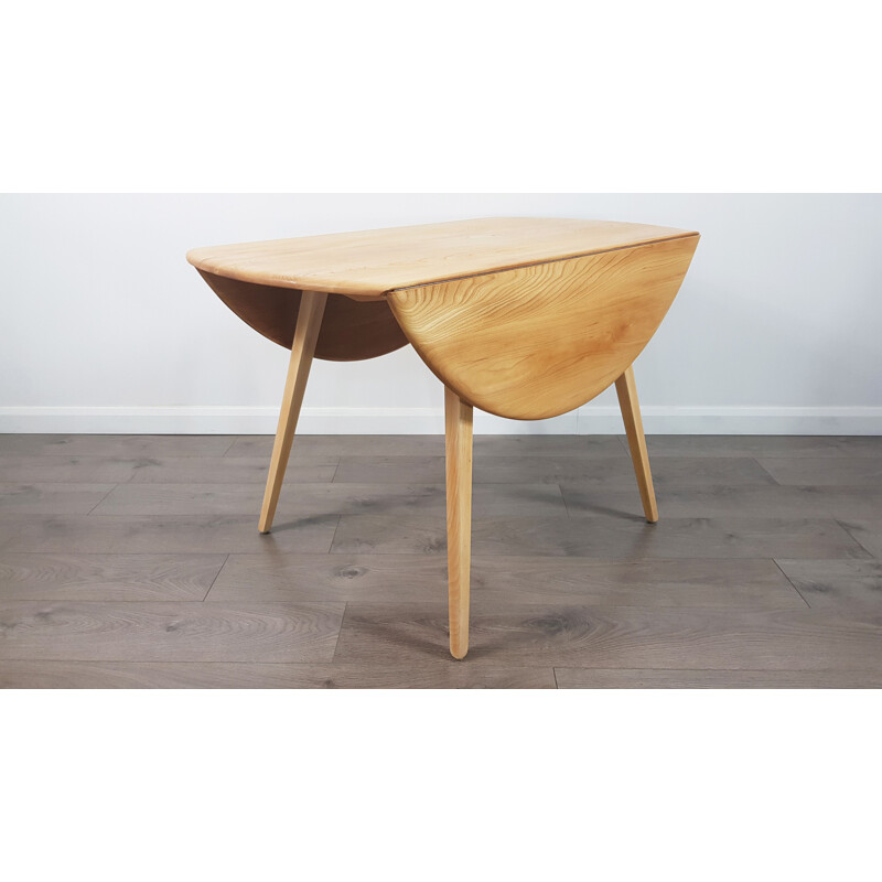 Table à repas vintage en orme, extensible, ronde, par Lucian Ercolani pour Ercol, des années 1960.