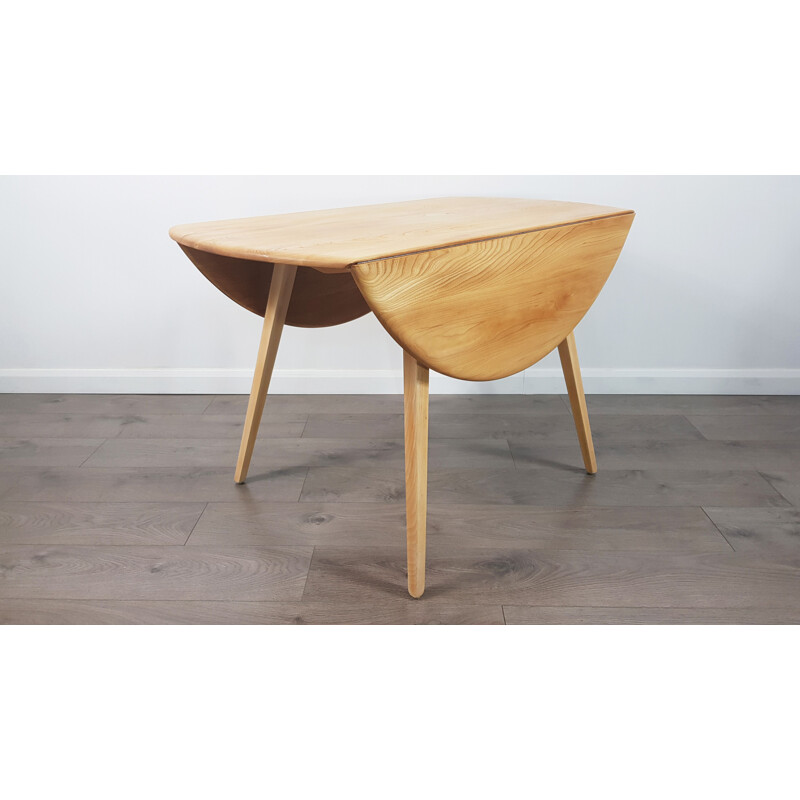 Vintage dining table in elm, Drop Leaf, Round by Lucian Ercolani for Ercol, 1960s.