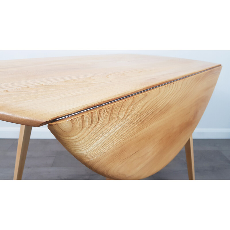 Vintage dining table in elm, Drop Leaf, Round by Lucian Ercolani for Ercol, 1960s.