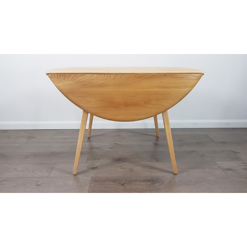 Vintage dining table in elm, Drop Leaf, Round by Lucian Ercolani for Ercol, 1960s.