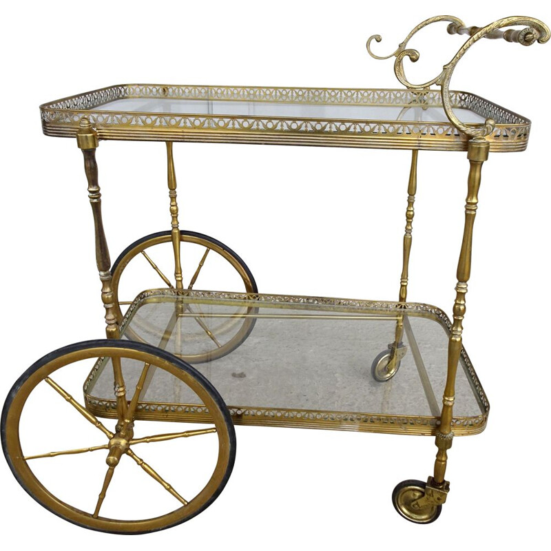 Vintage serving trolley in golden metal