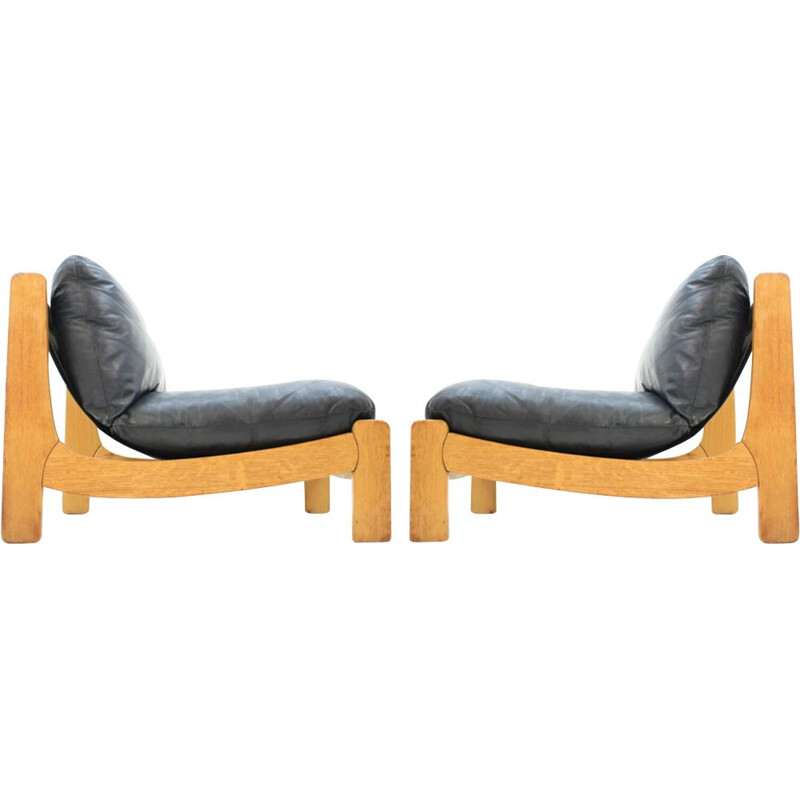 Pair of vintage scandinavian armchairs in black leather and wood 1970