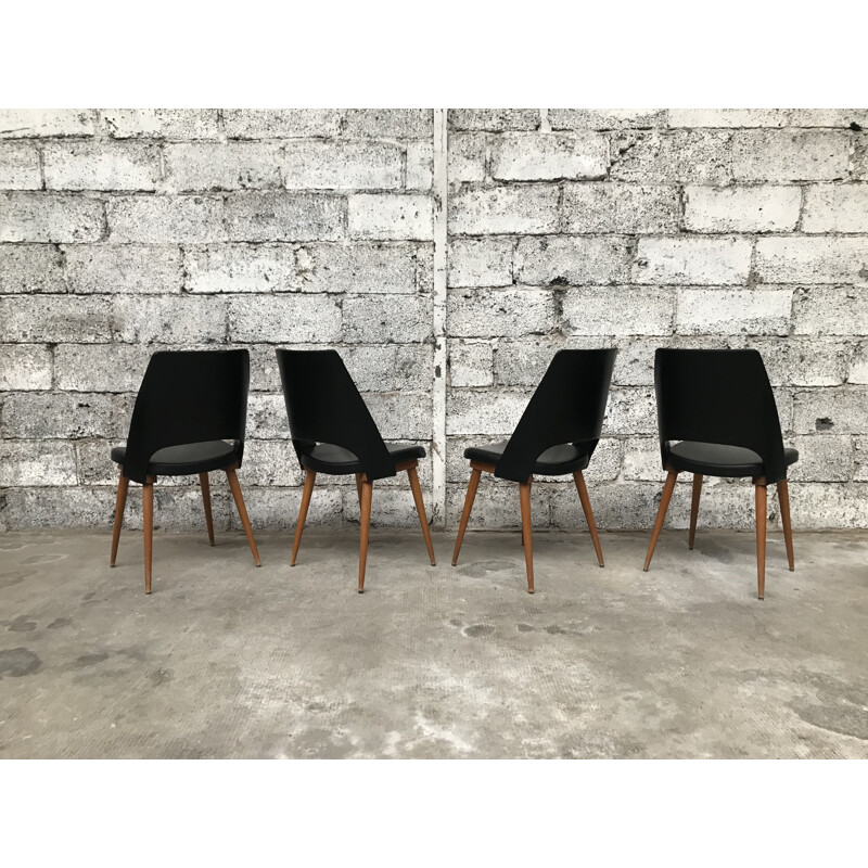 Set of 4 black Barrel chairs by Baumann