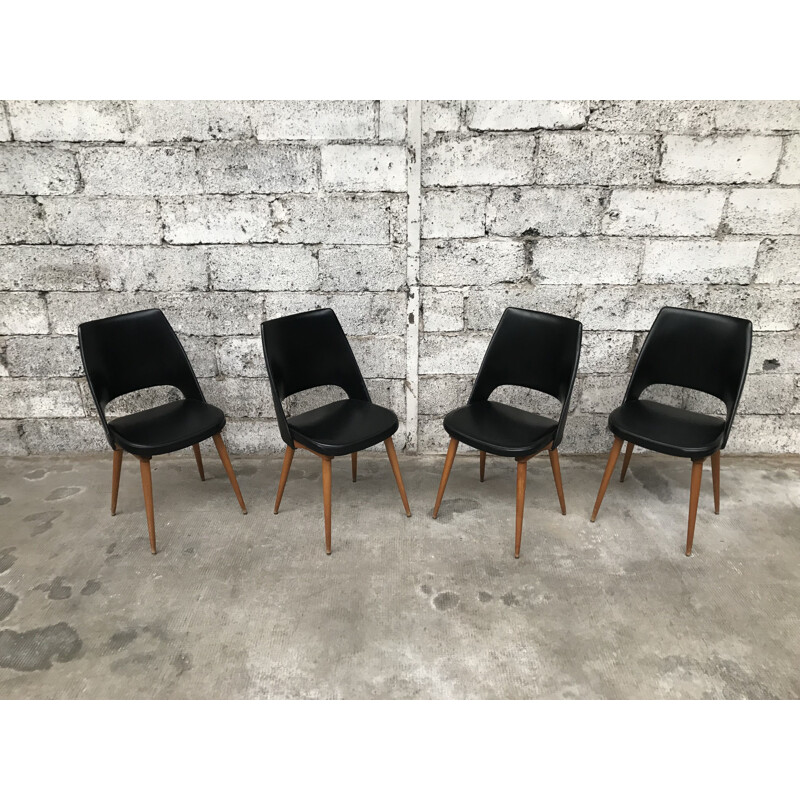 Set of 4 black Barrel chairs by Baumann