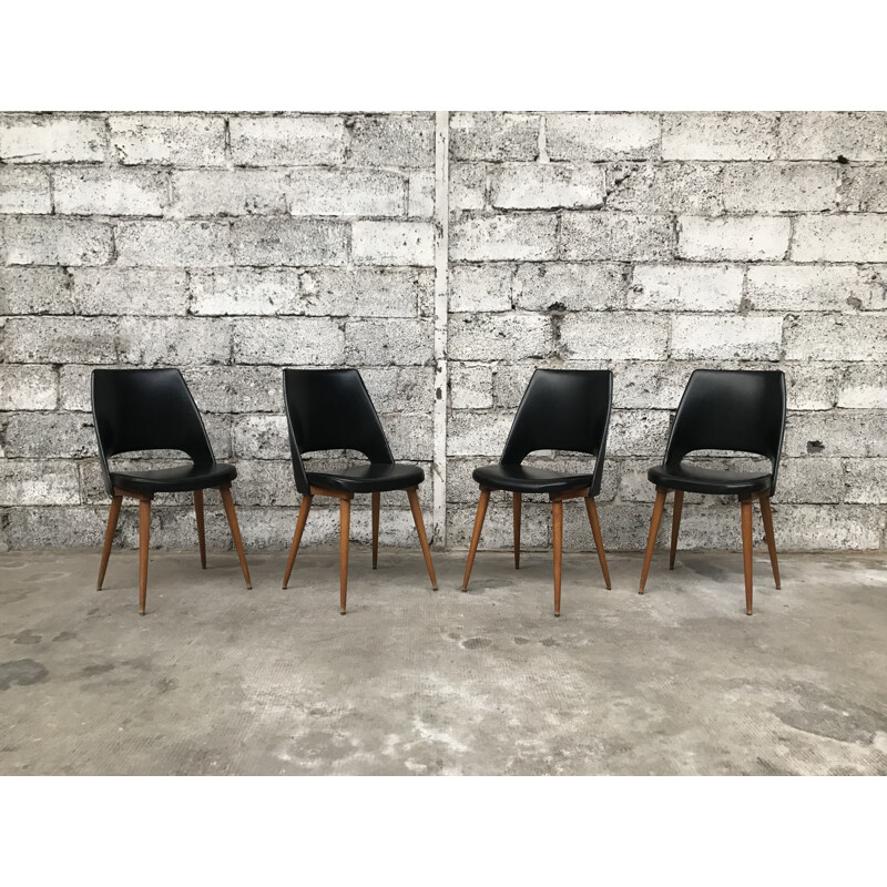 Set of 4 black Barrel chairs by Baumann