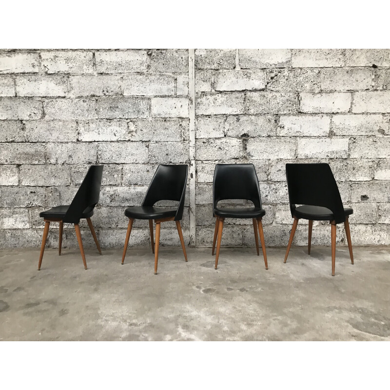 Set of 4 black Barrel chairs by Baumann