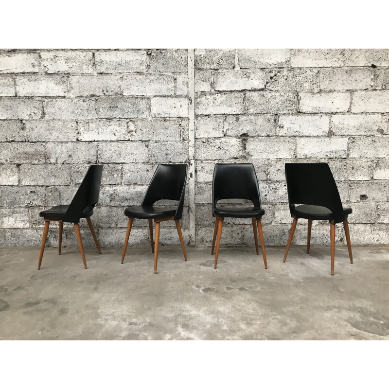 Suite de 4 chaises Tonneau noires par Baumann