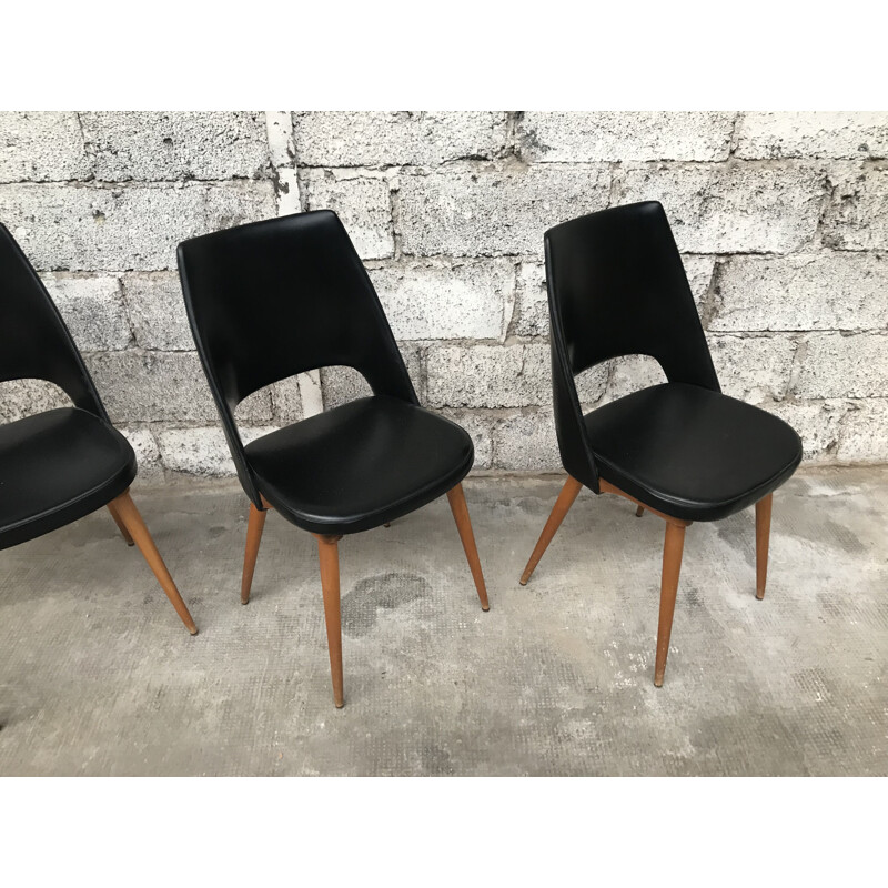 Set of 4 black Barrel chairs by Baumann