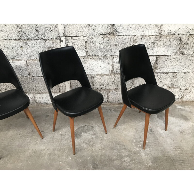 Suite de 4 chaises Tonneau noires par Baumann