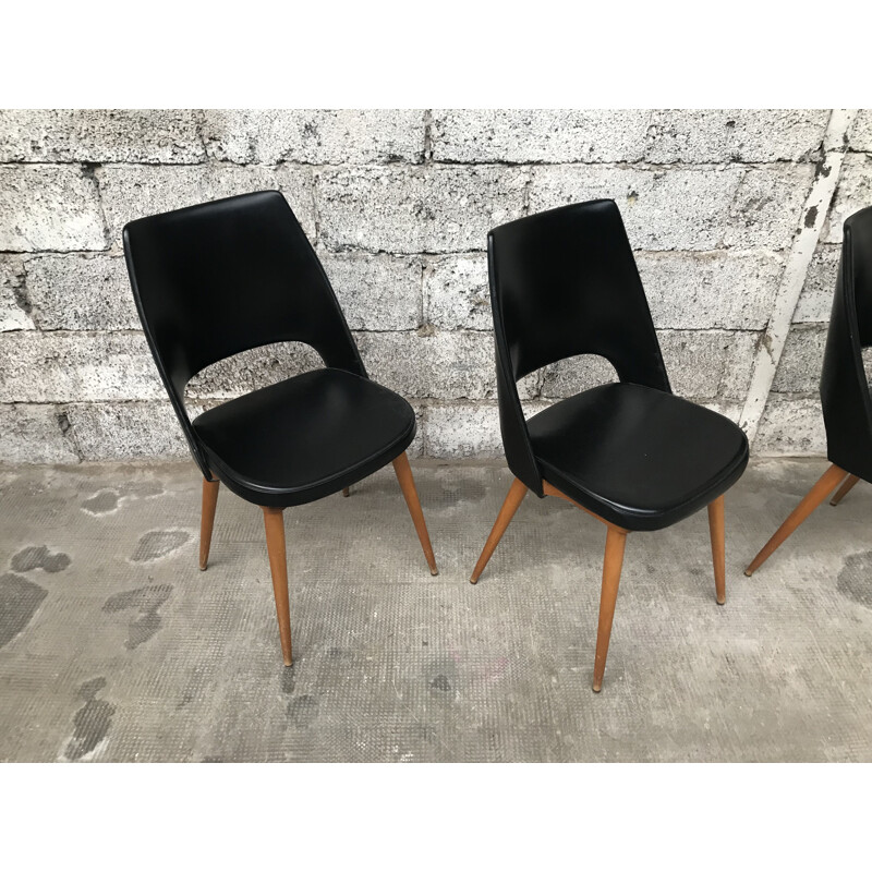 Set of 4 black Barrel chairs by Baumann