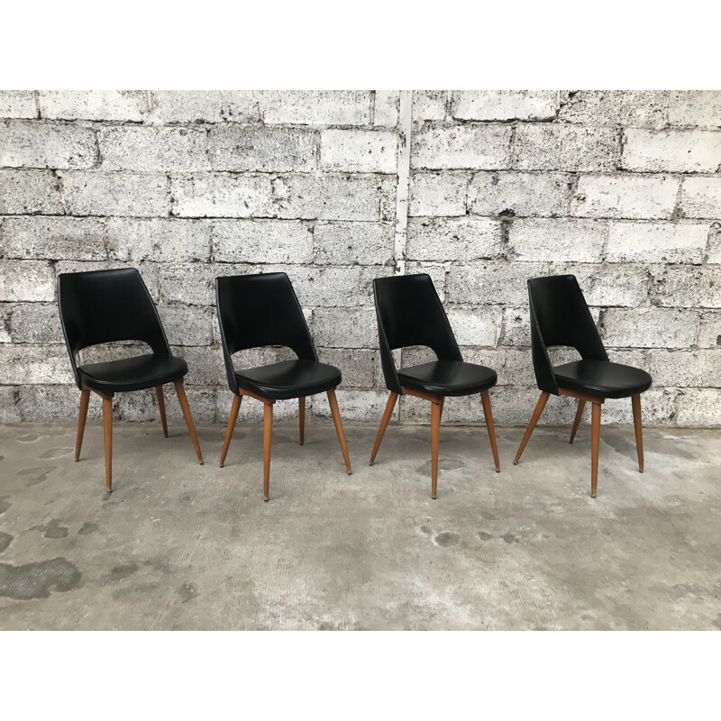 Set of 4 black Barrel chairs by Baumann