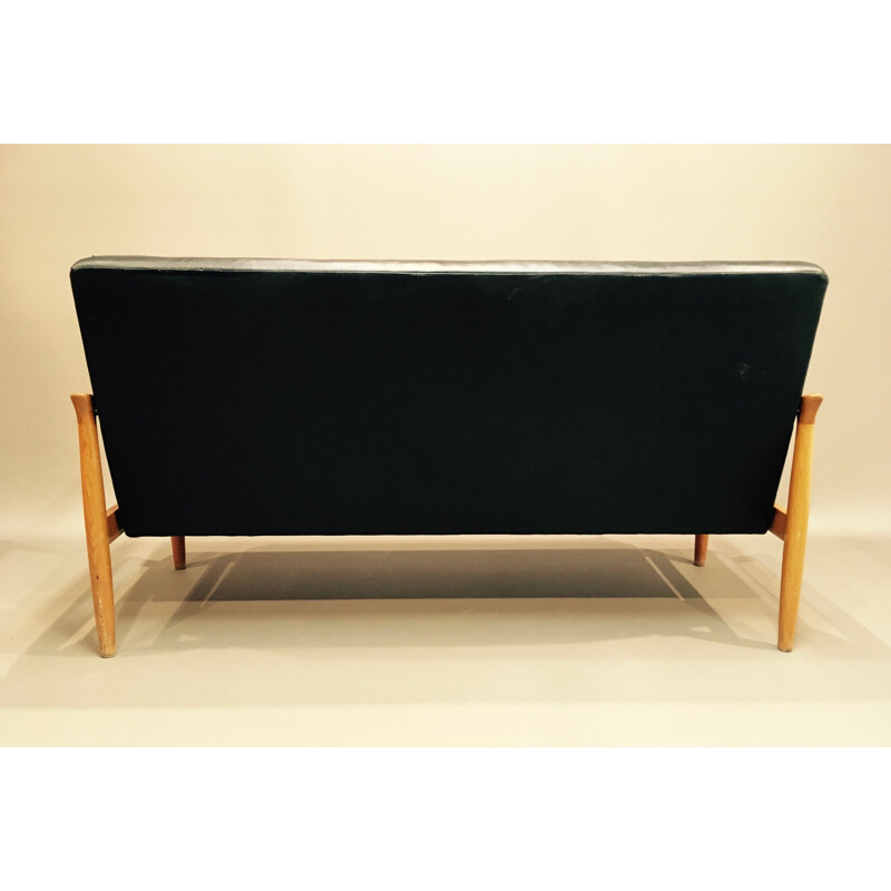 Vintage sofa in oak and leatherette by Fritz Hansen