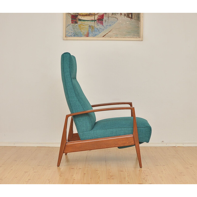 Green armchair in beechwood with folding footrest