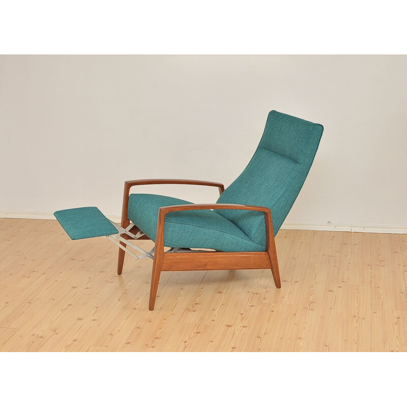 Green armchair in beechwood with folding footrest