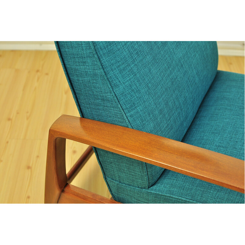 Green armchair in beechwood with folding footrest