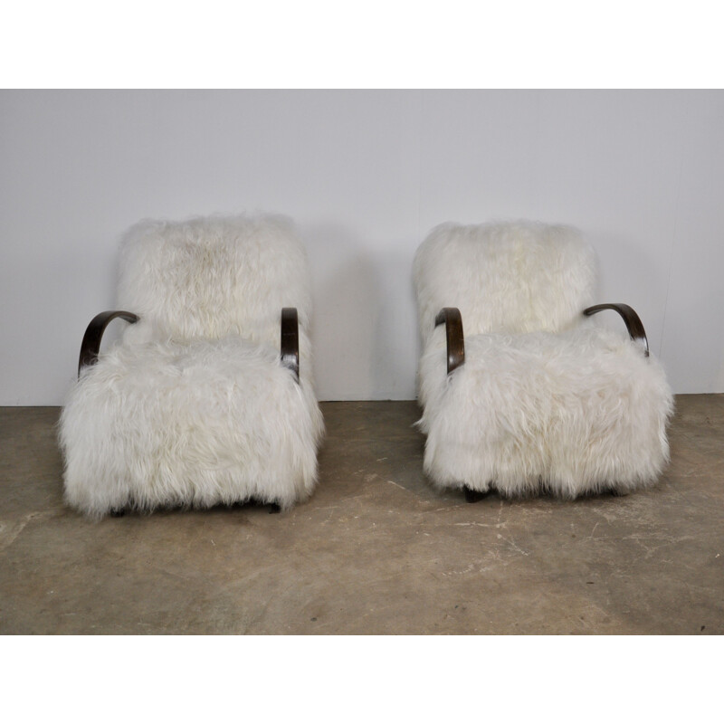 Pair of sheepskin armchairs by Jindrich Halabala