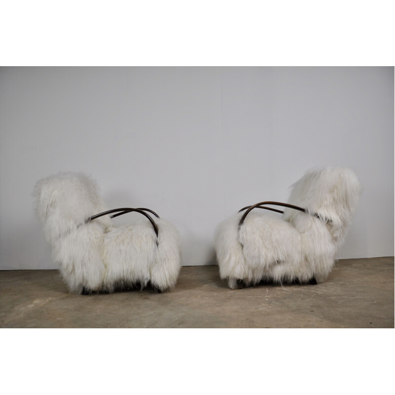 Pair of sheepskin armchairs by Jindrich Halabala