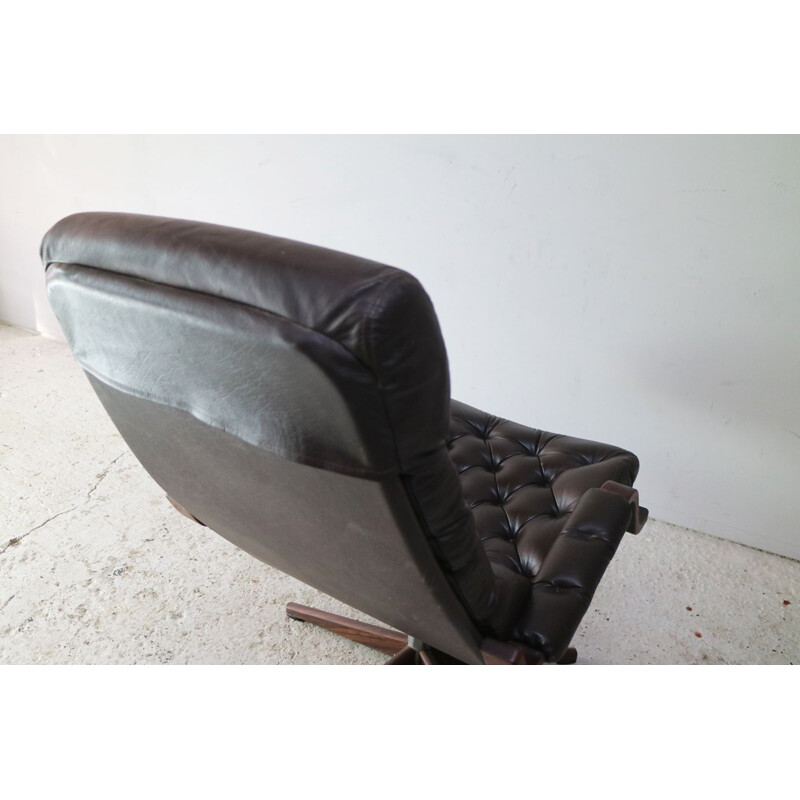 Danish swiveling armchair in black leather