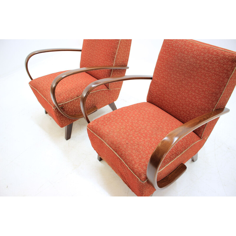 Pair of red armchairs by Jindřich Halabala