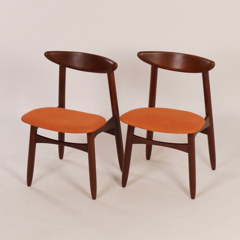Pair of orange chairs in teak