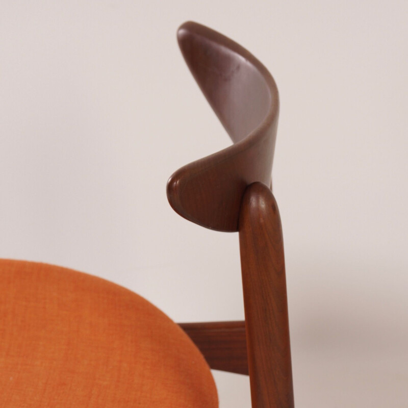 Pair of orange chairs in teak