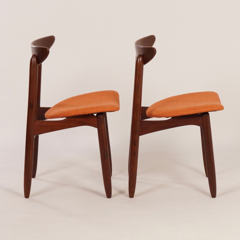 Pair of orange chairs in teak