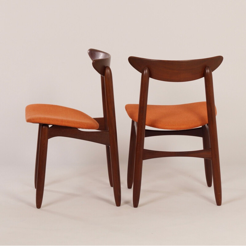 Pair of orange chairs in teak