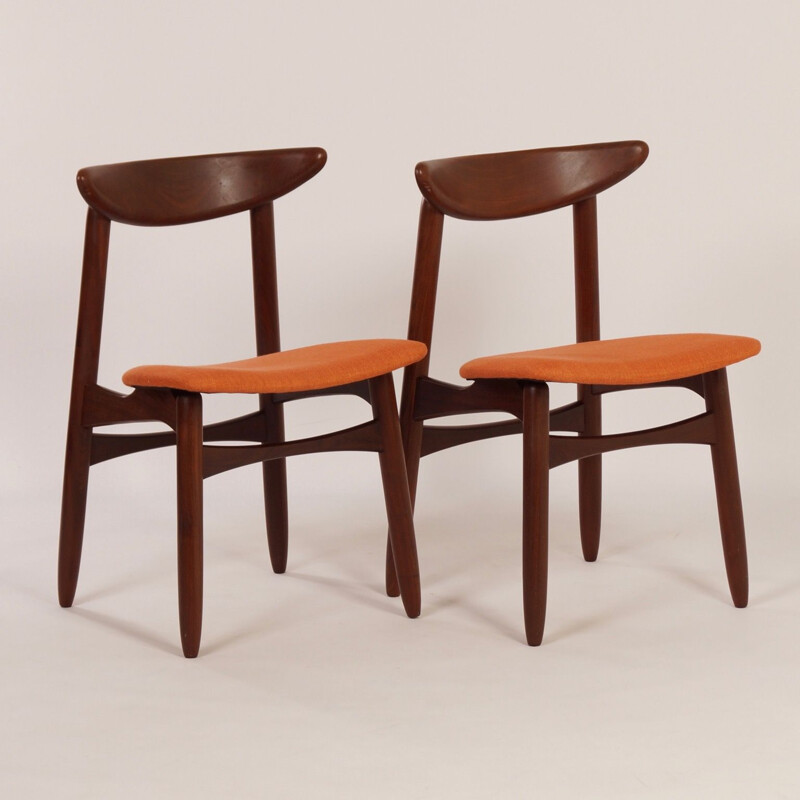 Pair of orange chairs in teak