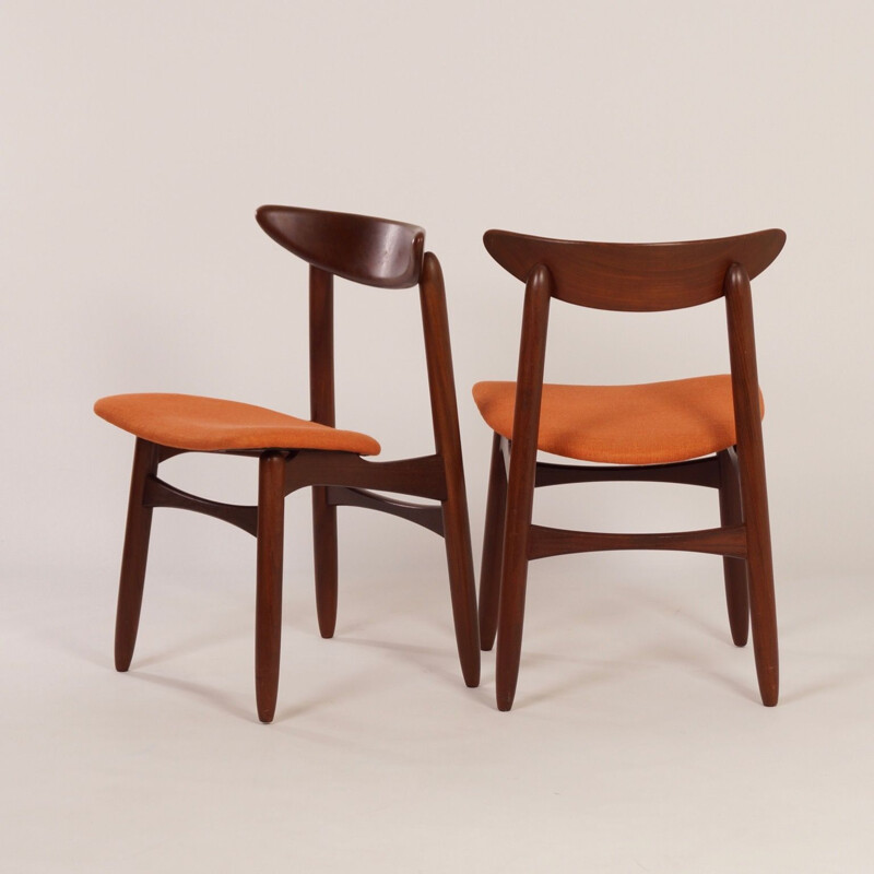 Pair of orange chairs in teak