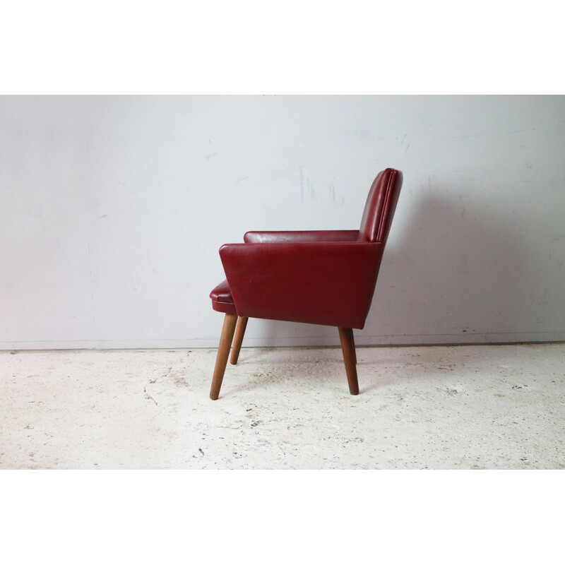 Vintage Danish armchair in red vinyl