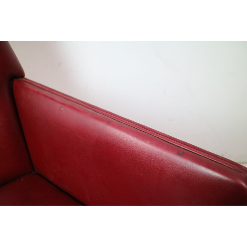 Vintage Danish armchair in red vinyl