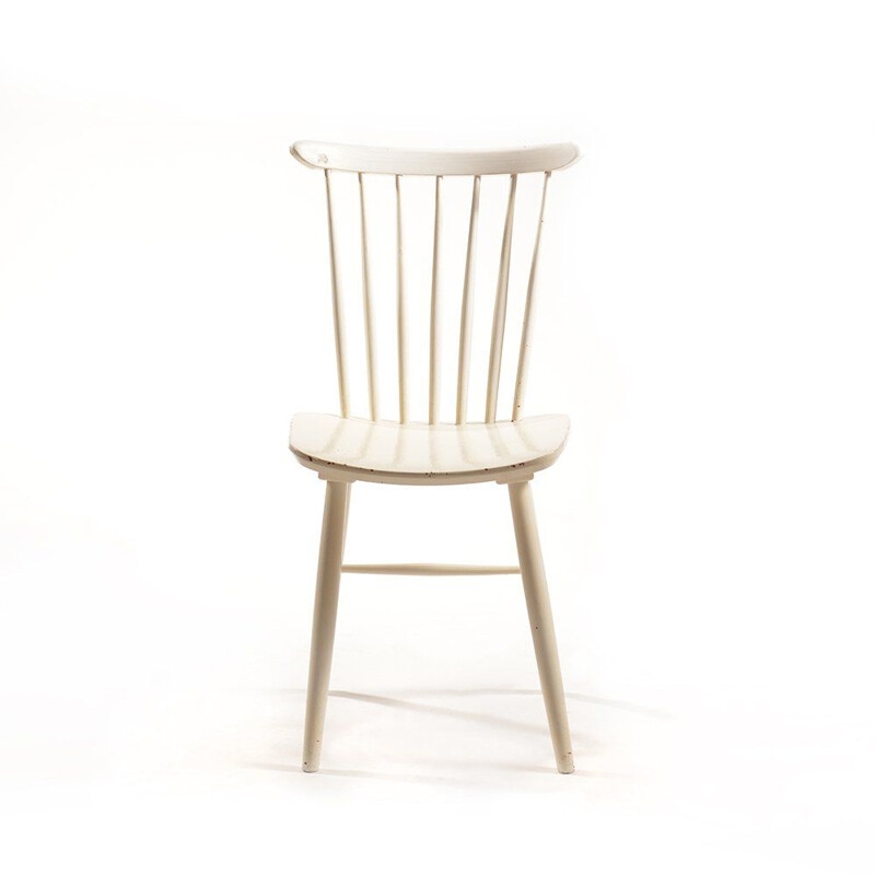 White vintage chair in solid wood and has been painted several times by TON, 1960