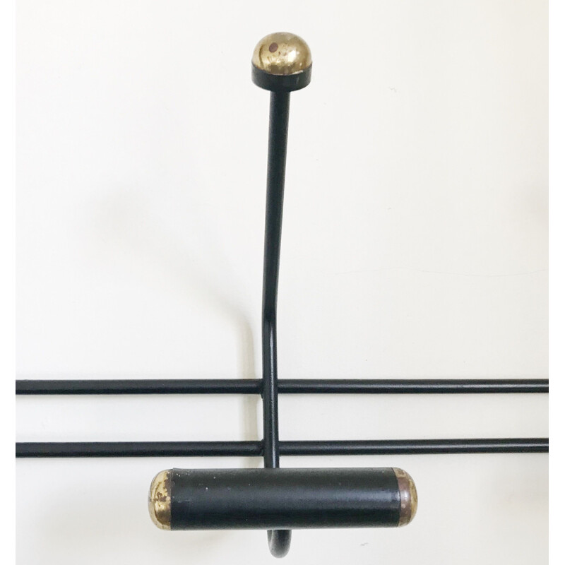Vintage black and gold wall coat rack from the 60s
