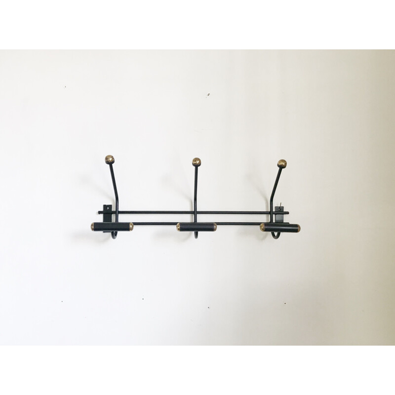 Vintage black and gold wall coat rack from the 60s