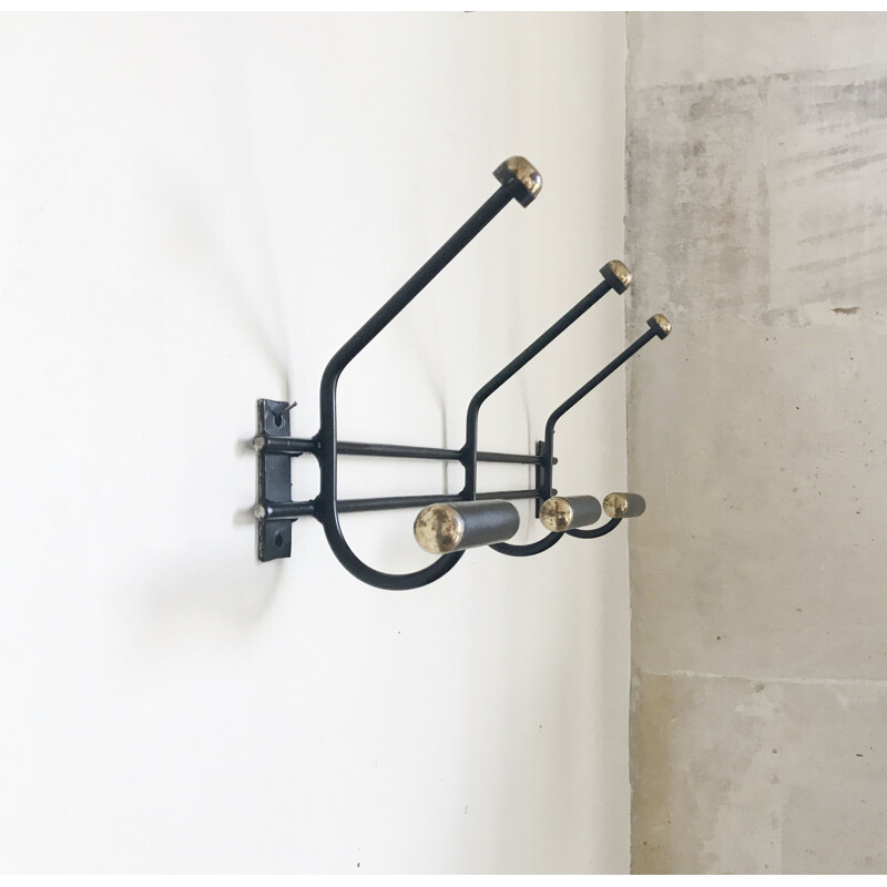 Vintage black and gold wall coat rack from the 60s