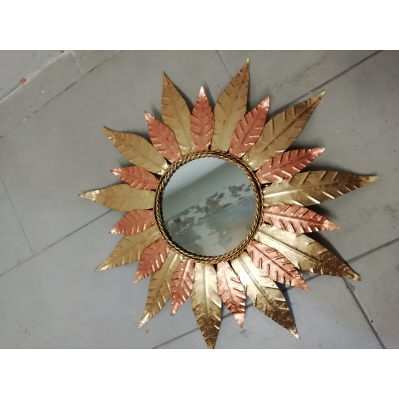 Vintage sun mirror in golden metal and copper 1970