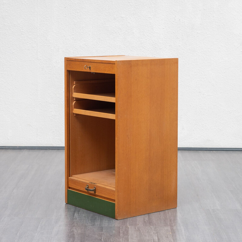 Vintage roller shutter cabinet in oak from the 50s