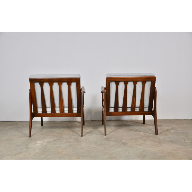 Pair of vintage scandinavian armchairs in teak and white fabric 1960