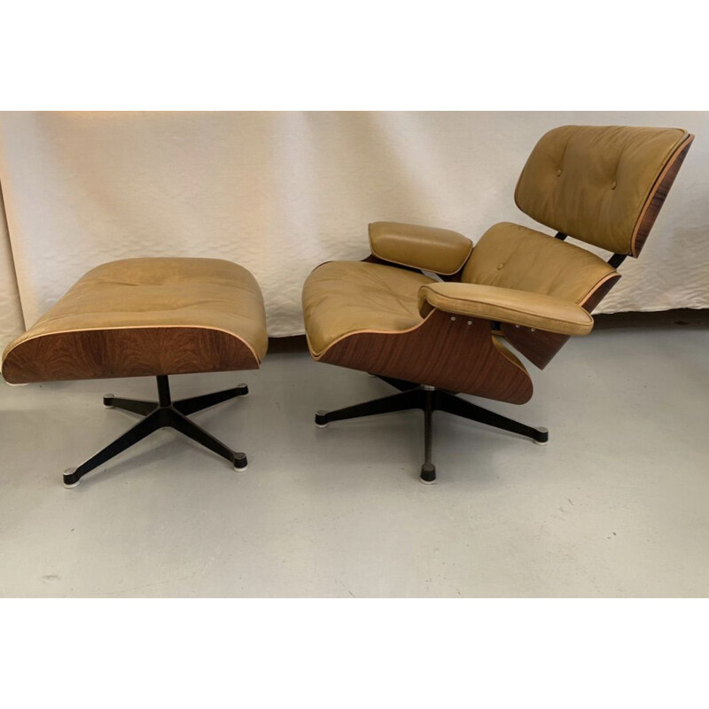 Vintage armchair and footrest 670 671 by Eames in leather and rosewood