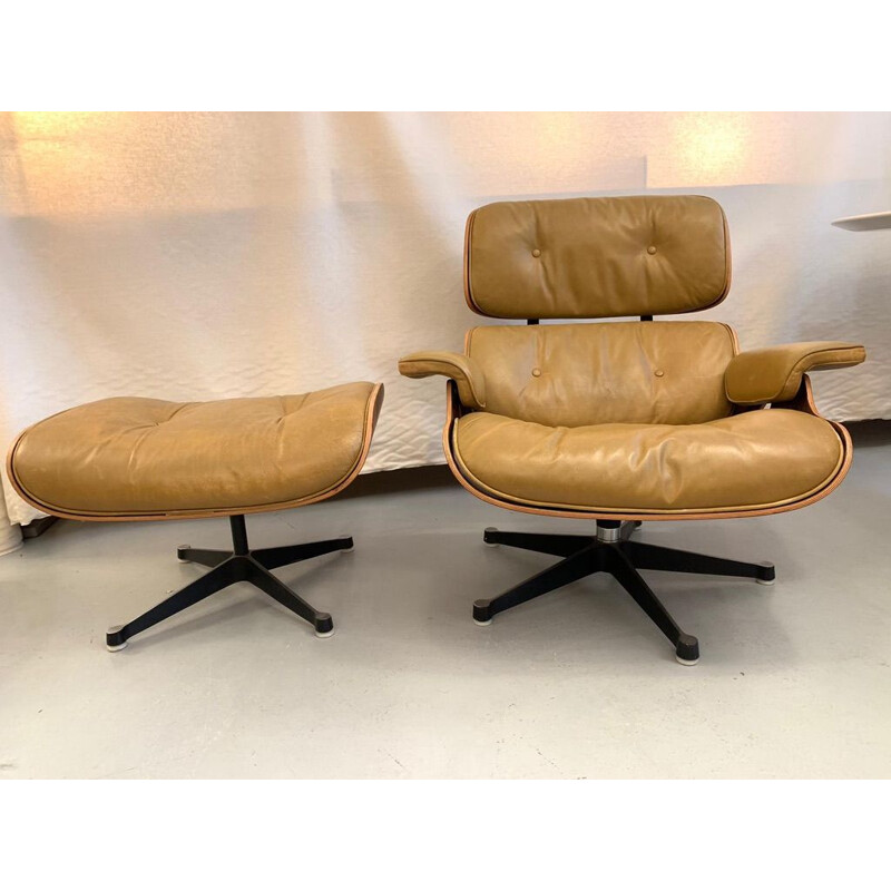 Vintage armchair and footrest 670 671 by Eames in leather and rosewood