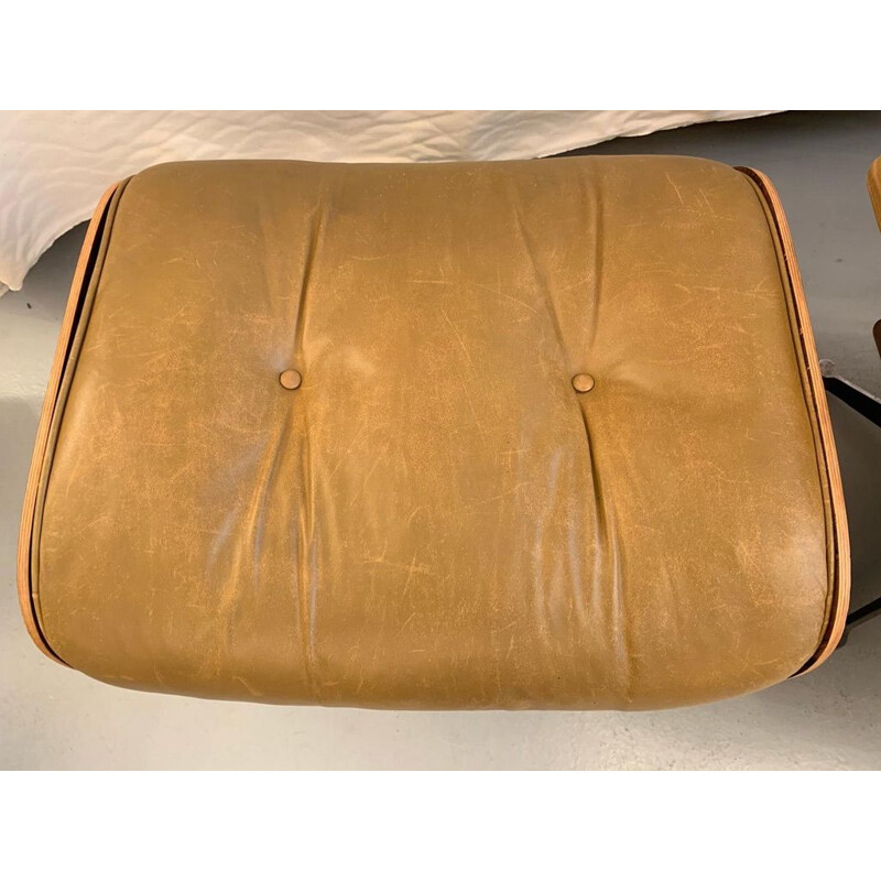 Vintage armchair and footrest 670 671 by Eames in leather and rosewood
