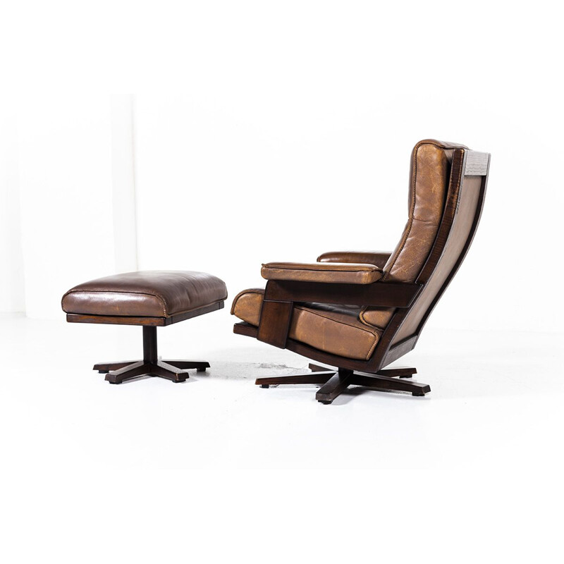 Vintage lounge swivel chair and ottoman by Harry de Groot for Leolux